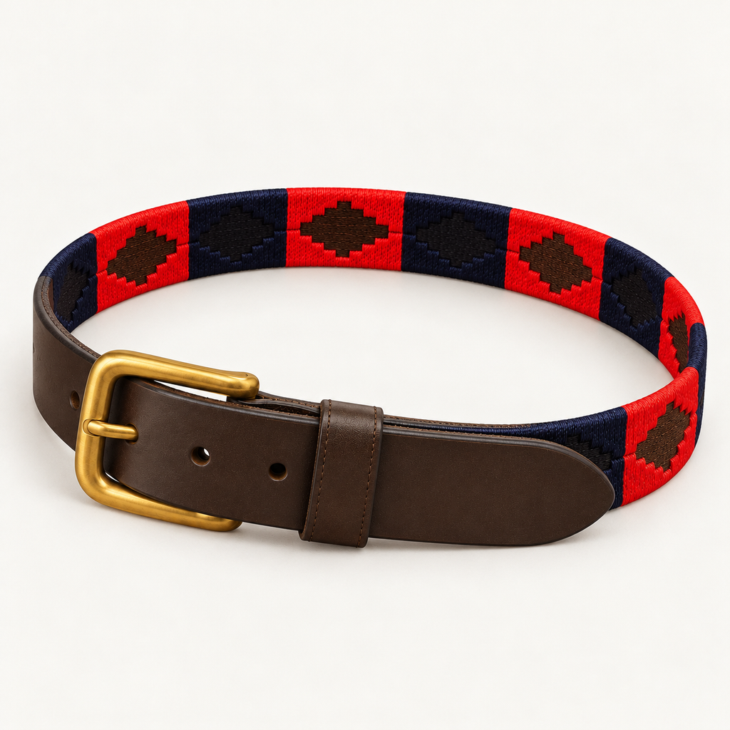 Red and navy handmade handwoven gaucho polo belt with brown leather and brass buckle, laid in an oval.