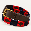 Red and navy handmade handwoven gaucho polo belt with brown leather and brass buckle, coiled front view.